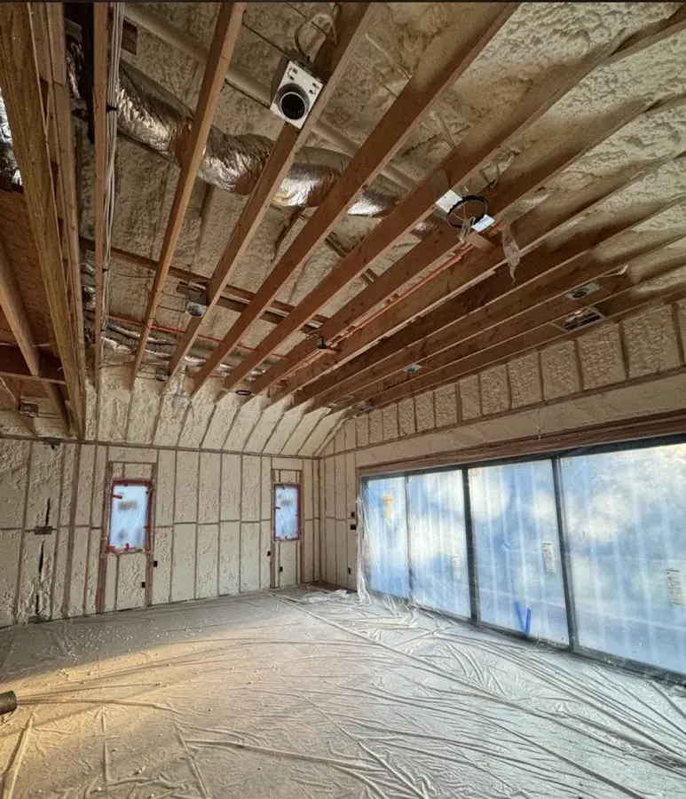 Interior walls and ceiling insulated with spray foam during new construction in Barbecue